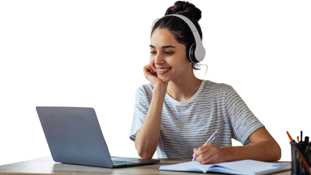 Alumna estudiando alemán online con los auriculares puestos a través de un ordenador portátil